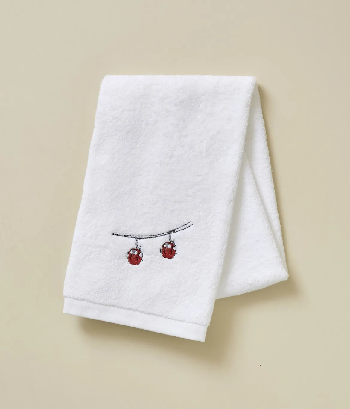 Serviette brodée Rdv au sommet blanc