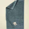 Serviette invité brodée 30x50 L'envol bleu fumé